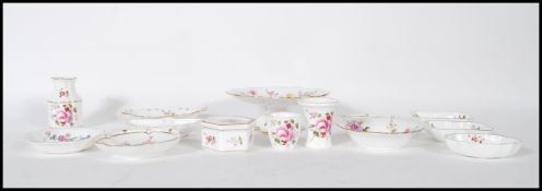 A collection of fourteen pieces of bone china by Royal Crown Derby, all decorated with fauna and