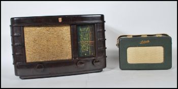 A vintage 20th Century bakelite valve radio by Philips, speaker grill, dial and knobs to front