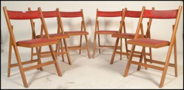 A set of 6 mid 20th century bentwood and tubular metal industrial stacking chairs. Each with painted