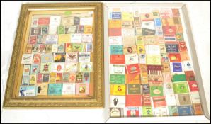 Two antique glazed picture frames having a montague of vintage 20th Century cigarette packets from