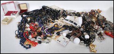 A collection of costume to include necklaces, brooches ( one panther ), earrings, gold tone