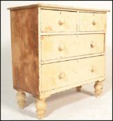 A Victorian 19th century shabby chic painted cottage chest of drawers. Raised on bun feet with 2