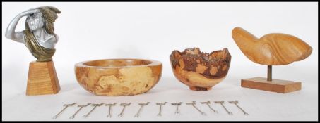 A collection of 20th Century treen items to include a burr walnut trinket bowl having a cast