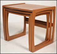 A retro 20th Century teak wood two tier buffet trolley of Danish inspiration raised on tapering