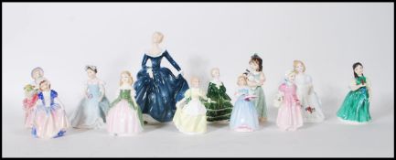 A collection of eleven Royal Doulton ceramic figurines to include Cissie HN 1809 First Recital HN