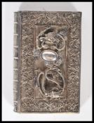 An early 20th Century Chinese silver filigree calling card case in the form of a book having applied