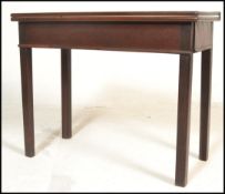 An 18th century George III mahogany tea table. Raised on squared legs with a fitted frieze frame