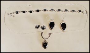 A stamped 925 silver demi parure jewellery set consisting of teardrop earrings, collar necklace
