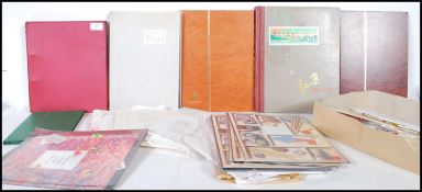 A collection of British stamp first day covers mostly loose examples with six albums and some