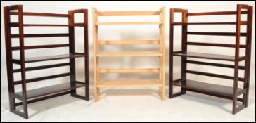 A pair of vintage style 20th Century wooden folding metamorphic bookcases / traders display shelves.