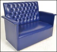 An unusual 20th century small blue vinyl upholstered childs sofa / dog seat settee having squared