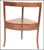 A Georgian mahogany inlaid  corner two tier wash stand, single drawert to lower tier raised on