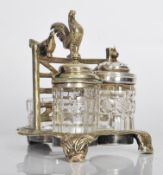 A 19th Century High Victorian silver plated and cut glass three piece table cruet set, the silver