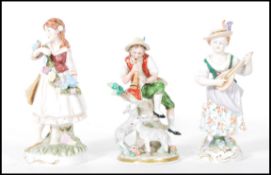 A group of three German continental porcelain figures dating from the early 20th Century to