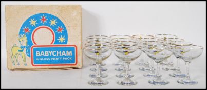 A selection of 20th Century vintage retro Babycham glasses having printed yellow fawn logo's to