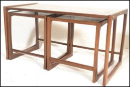 A retro 20th Century teak wood Danish inspired nest of occasional tables possibly by G Plan in the