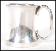 Hunting interest- A silver hallmarked toddy cup of simple form having a plane shaped handle with