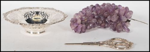 A silver hallmarked Mappin & Webb grape dish with pierced outer lip. Hallmarked for London for 1975.