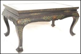 A 20th Century Japanese Shibayama black lacquered folding campaign rectangular coffee table, the top
