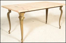 A vintage 20th century marble topped coffee table of rectangular form being raised on gilt antique