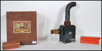 An early 20th Century Ernst Plank Tinplate Gloria magic lantern outfit, the tinplate lantern on