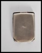A vintage 20th Century Silver hallmarked engine turned match book holder, clasp to base with