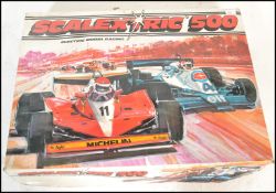 A vintage retro 20th Century Scalextric 500 electronic slot car racing game. Cars included Elf
