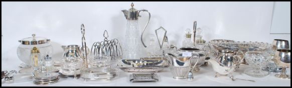 A large collection of 20th Century silver plated dinnerware / tea ware to include a cut glass claret