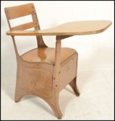 A vintage 20th Century school chair desk, the chair constructed from metal, raised on shaped
