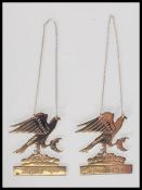 A pair of silver hallmarked drinks labels for Gin and Port, the labels modelled as eagles in