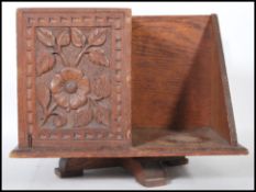 A 19th century carved oak Victorian table top revolving bookcase. Raised on a quadruped leg base