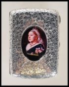 An early 20th Century silver hallmarked cigarette case of rectangular bowed form having engraved