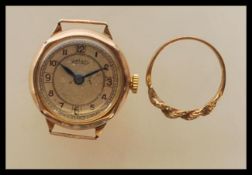 A mid 20th Century 9ct gold case Rotary wrist watch having a round face with arabic numerals to