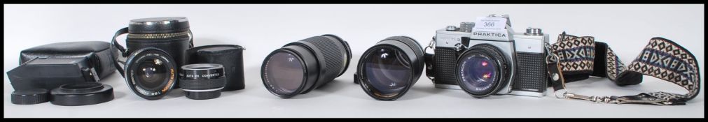 A Praktica Super TL 3 film camera body with a Pentacon auto 1.8/50, a Cimko MT Series 1:5.6 100-