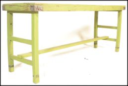 A retro 19th century shabby chic scullery table / dining table in pine being painted green.  Planked