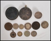 A collection of coins dating from the 18th century onwards to include a 1797 cartwheel, a 1780 Maria
