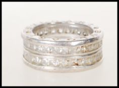 A silver Bvlgari ladies dress ring set with two layers of square cut white stones, inscribed Bvlgari