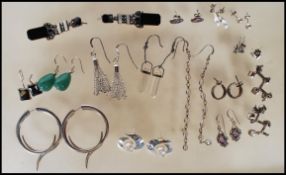 A collection silver earring pairs to include a pair of Art Deco style earrings having illusion