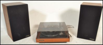 A 1970's Marconiphone record deck and radio  complete with the speakers, all in teak wood surround