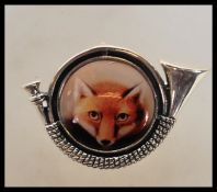 Hunting interest- A silver stamped 925 brooch pendant having a central enamelled panel depicting a