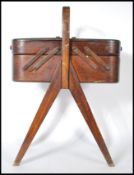 A vintage retro 20th Century teak wood multi sectional cantilever work box / sewing box, metamorphic