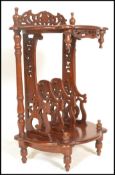 A 20th Century mahogany antique style hall side table canterbury magazine stand of two tier demi
