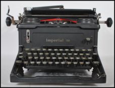 A vintage 20th Century Imperial 58 industrial typewriter, black silvered buttons, makers mark to the