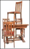 A 1930's oak draw leaf refectory dining table raised on bulbous legs with splayed feet together with