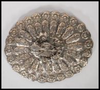 A continental silver ladies dressing table palm mirror. The hand mirror with silver leaves and