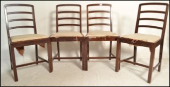 A set of four 1960's vintage afromosia (African teak) dining chairs by Richard Hornby for Heals, the