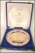 A cased limited edition (557/2000) silver London hallmarked plate commemorating the marriage of