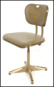 A mid century Industrial office swivel desk chair of metal construction in the manner of Tansad