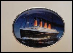 A stamped 925 silver large pill box of oval form having the hinged lid enamelled depicting the