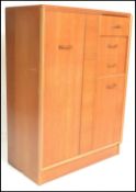 E. Gomme- G Plan- Brandon Range- A retro mid 20th Century light oak tallboy, with full length